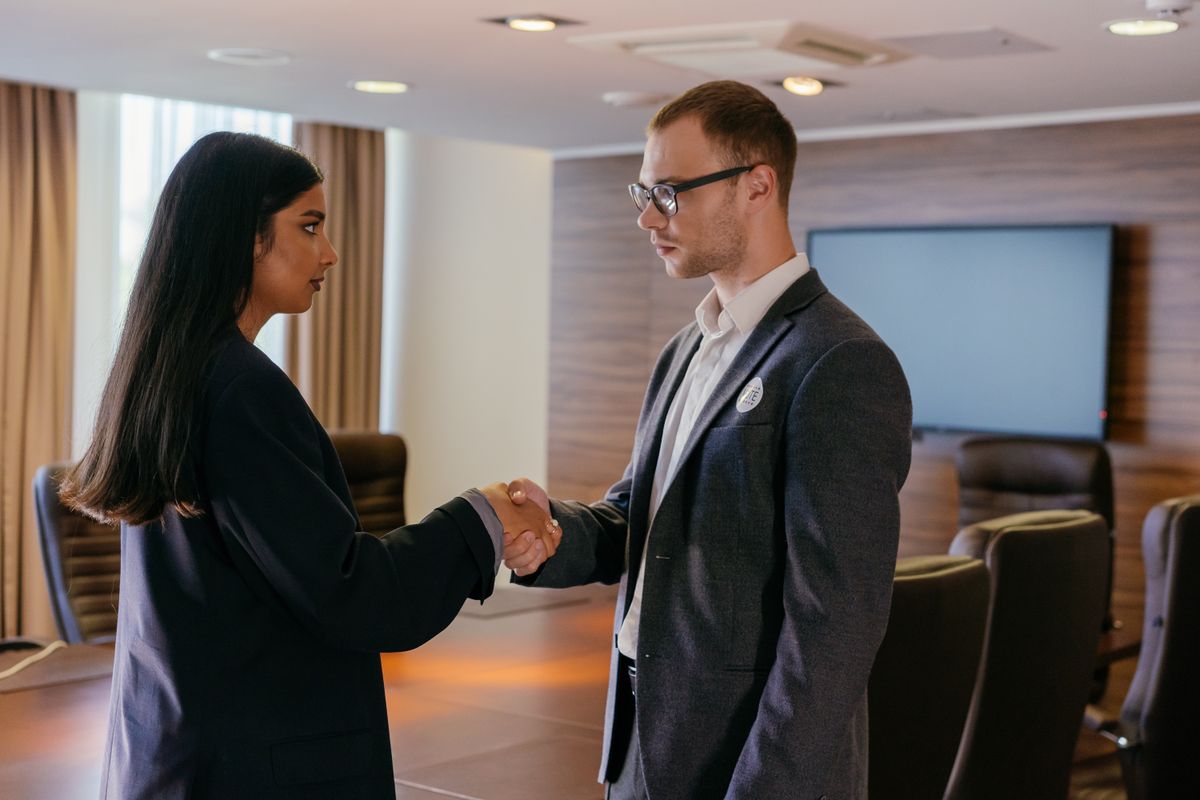 Two professionals shaking hands after an interview